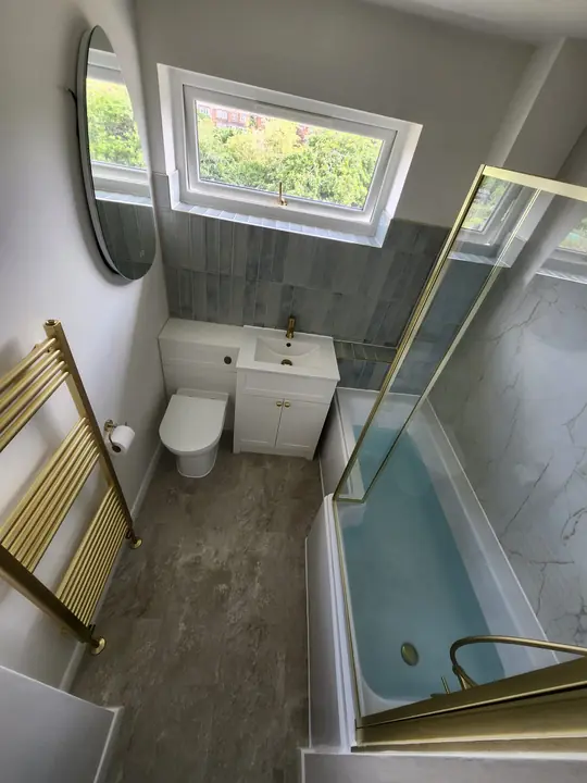Blue and brass family bathroom
