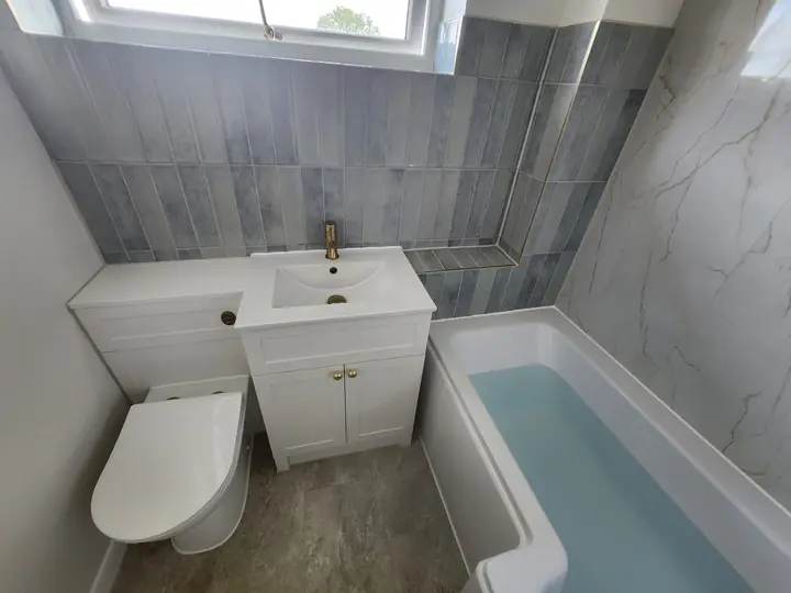 Blue and brass family bathroom