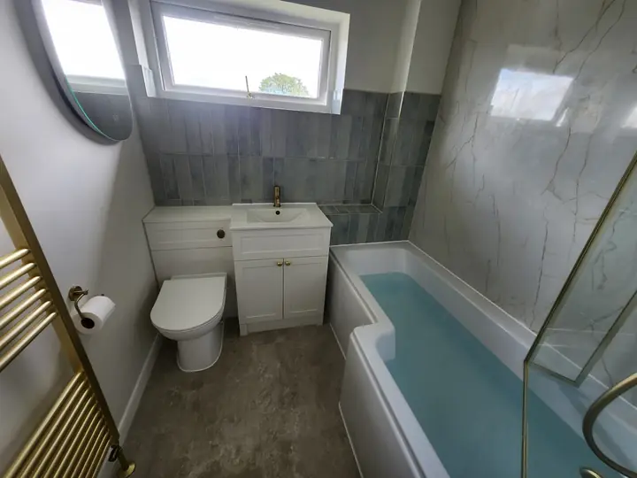 Blue and brass family bathroom