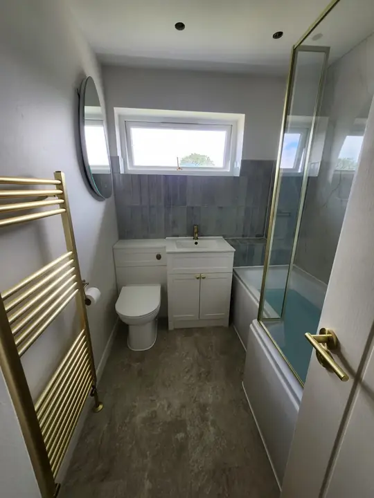 Blue and brass family bathroom