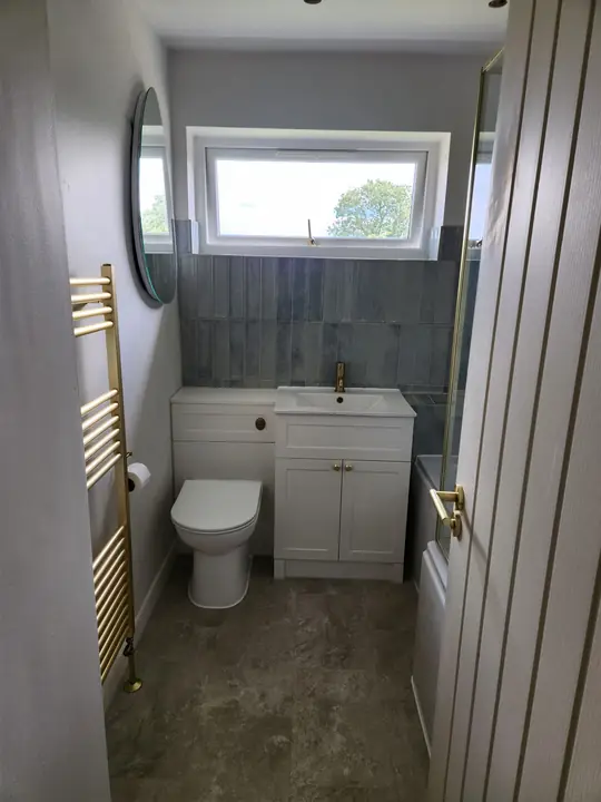 Blue and brass family bathroom
