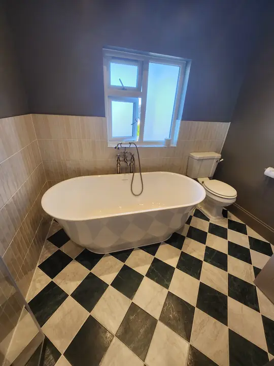 Chequerboard bathroom with brass