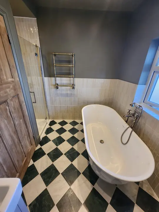 Chequerboard bathroom with brass