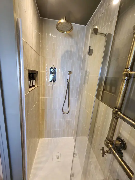 Chequerboard bathroom with brass