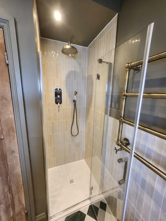 Chequerboard bathroom with brass