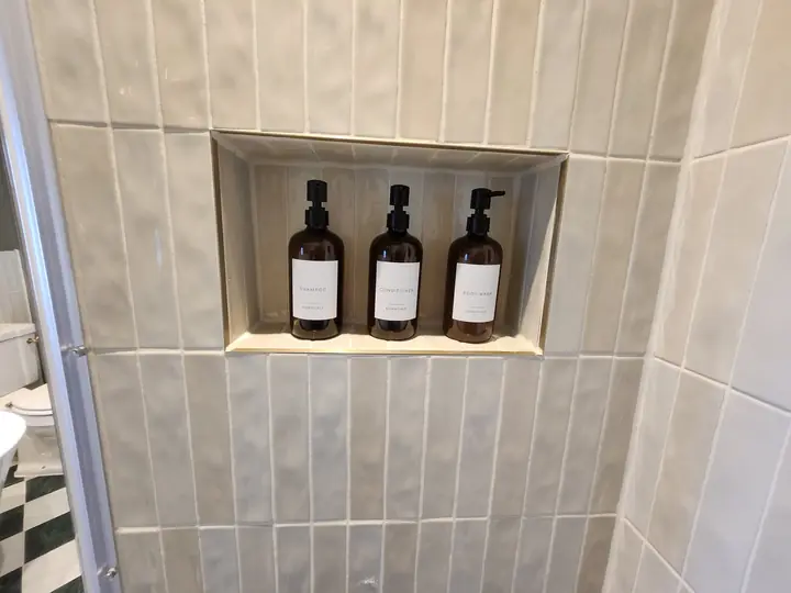 Chequerboard bathroom with brass