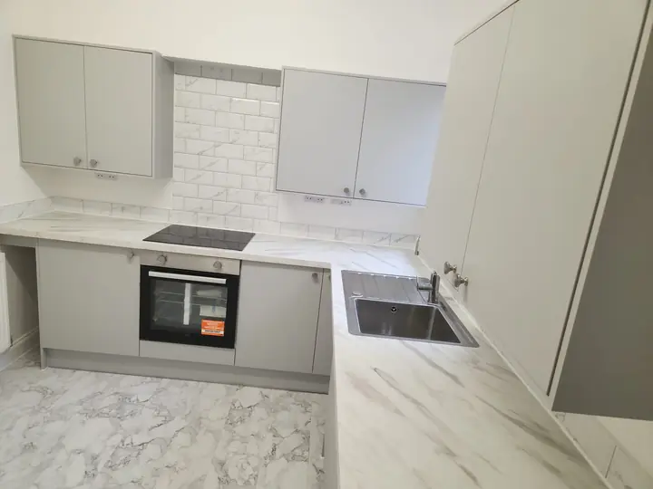 Grey kitchen with marble-effect worktops
